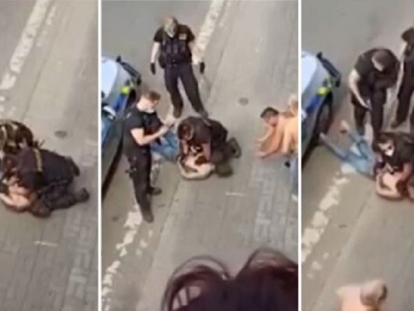 Видеозаписи на полицай, свалил на земята мъж от ромски произход
